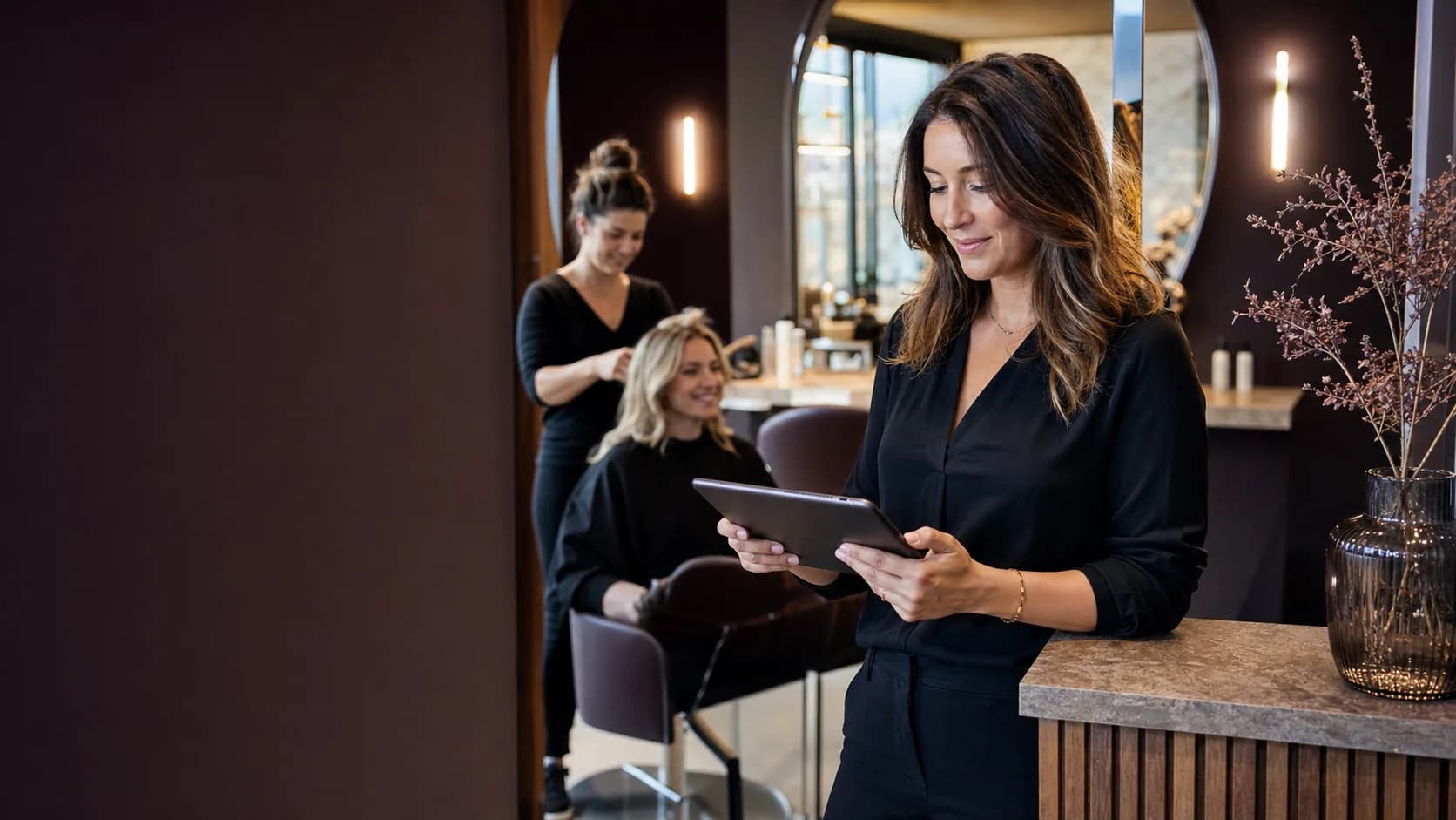 Hair salon owner reviewing the day's appointments